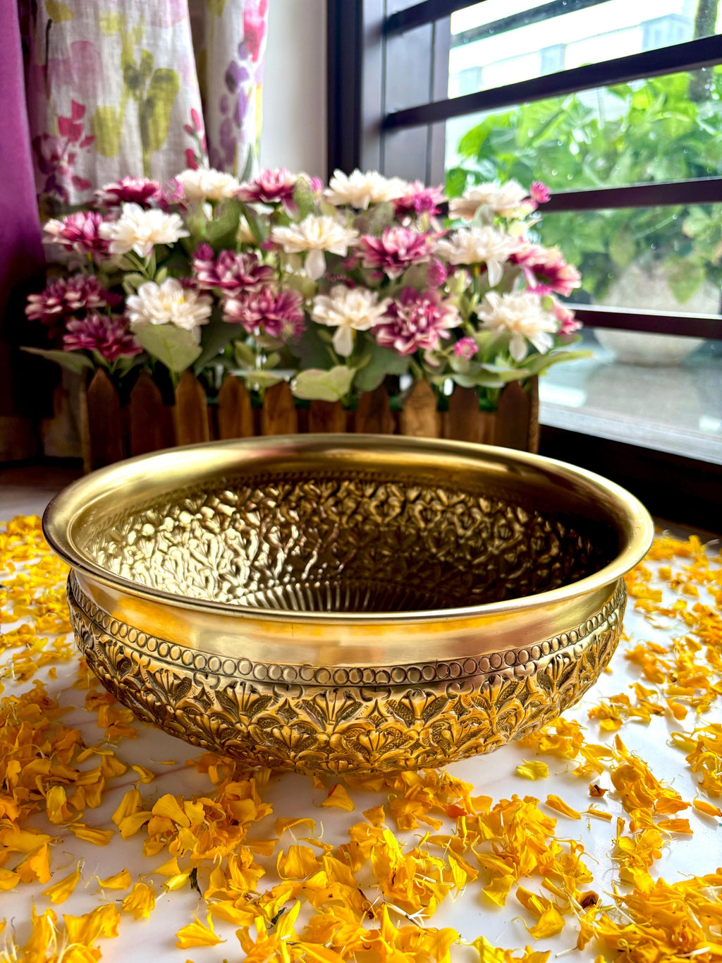 This  Brass Urli Bows can be used with  with fresh flowers or candles